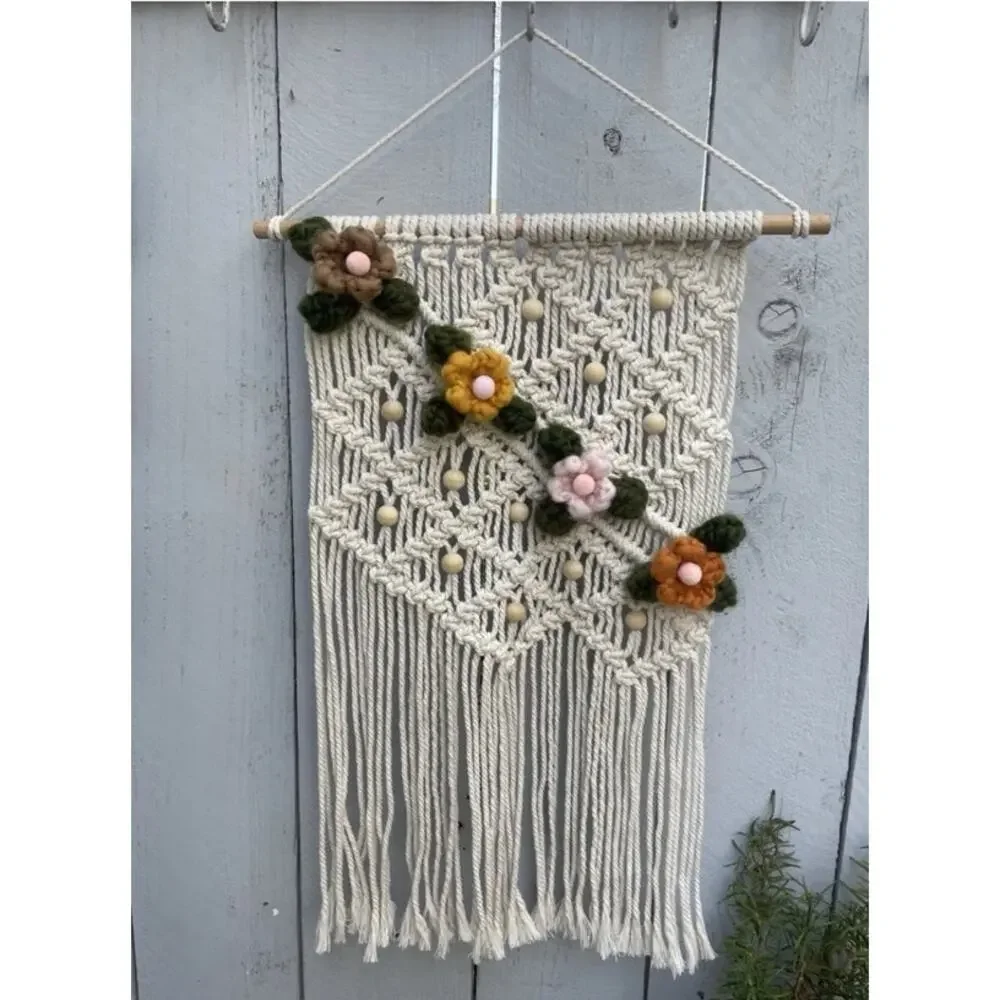 handmade boho-style macramé wall hanging crocheted flowers wooden beads fringe